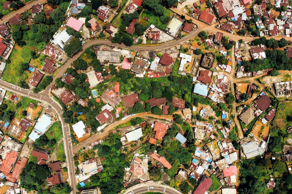 An aerial top-down view of the rooftops of a residential neighbourhood.